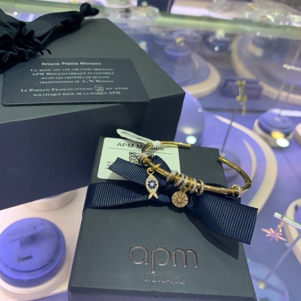 APM Monaco Gold Tone Bracelet with Fish and Star Charms